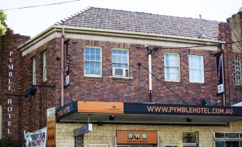 "a brick building with two windows and a sign that says "" www . pymbleberry .""." at Nightcap at Pymble Hotel