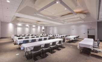 a large conference room with rows of tables and chairs , all set up for a meeting at Dale Hollow Lake State Resort Park