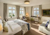 Hotel Am Leuchtturm Отели в г. Варнемюнде