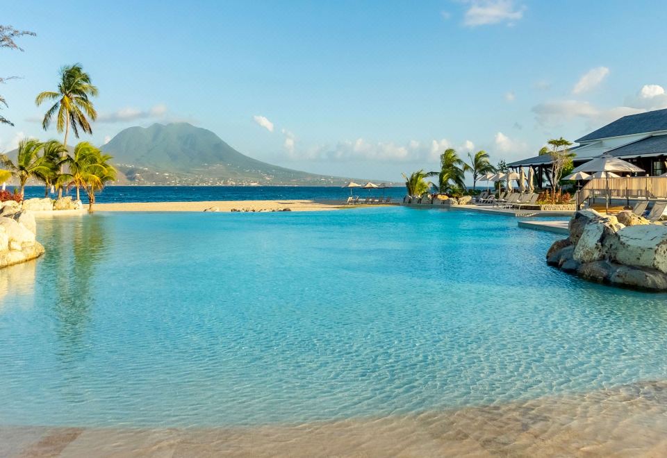 a large body of water , possibly a lake or a lagoon , surrounded by a tropical landscape at Park Hyatt St Kitts Christophe Harbour