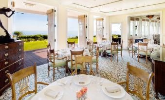 a dining room with tables and chairs arranged for a group of people to enjoy a meal at Montage Laguna Beach