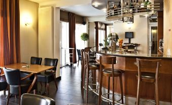a modern bar with wooden chairs and tables , a counter , and hanging lights , all decorated in a spacious room at Hotel the Shepherd