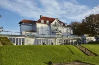 Sixtus Sinatur Hotel & Konference Hotels near Husby Kirke