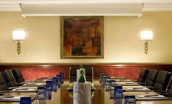 a large conference room with a long table and chairs , set up for a meeting at Washington Dulles Airport Marriott