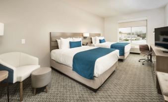 a hotel room with two beds , one on the left and one on the right side of the room at Best Western Plus Executive Residency Austin