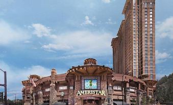 a large building with a unique design , possibly a hotel or casino , surrounded by trees at Ameristar Casino Black Hawk