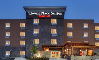 "a large hotel building with a stone facade and the words "" towneplace suites marriott "" on its sign" at TownePlace Suites Gainesville Northwest