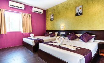 a hotel room with two beds , each made up with white sheets and brown bedspreads , along with a window and curtains at Hotel Sri Bernam