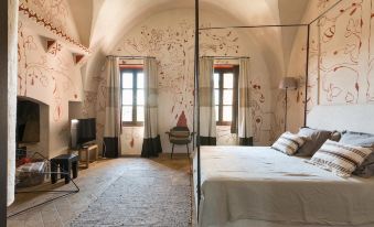 A bedroom with two beds and an attached bathroom at Casino Doxi Stracca by BarbarHouse