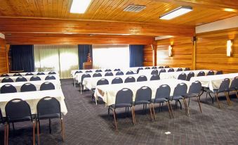 a large room with rows of chairs and tables , all set up for an event at Best Western Edgewater Resort