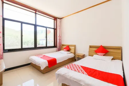 Yi county xinwang farmers Отели в г. Исянь