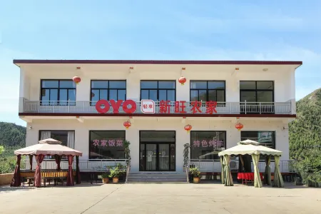 Yi county xinwang farmers Отели в г. Исянь