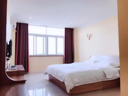 Yanggu Hospitality Business Hotel Отели рядом с достопримечательностью «Suhai Senlin Dongwu World»