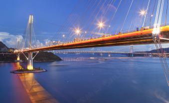 At night, the bridge offers a scenic view of filming locations and major cities at Royal View Hotel