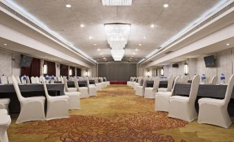 The hotel has a spacious ballroom equipped with rows of chairs, suitable for hosting various events and functions at Kingtown Hotel Plaza Shanghai