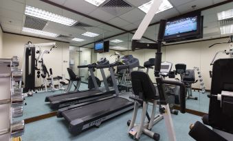 A spacious room in the center is equipped with treadmills and exercise equipment for everyone's use at Rosedale Hotel Hong Kong