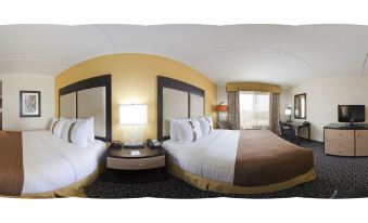 a hotel room with two beds , one on the left and one on the right side of the room at Hilton Garden Inn Columbia Airport