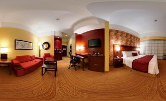a hotel room with a bed , desk , chair , and television is shown in an 3 6 0 - degree panoramic view at Courtyard Troy