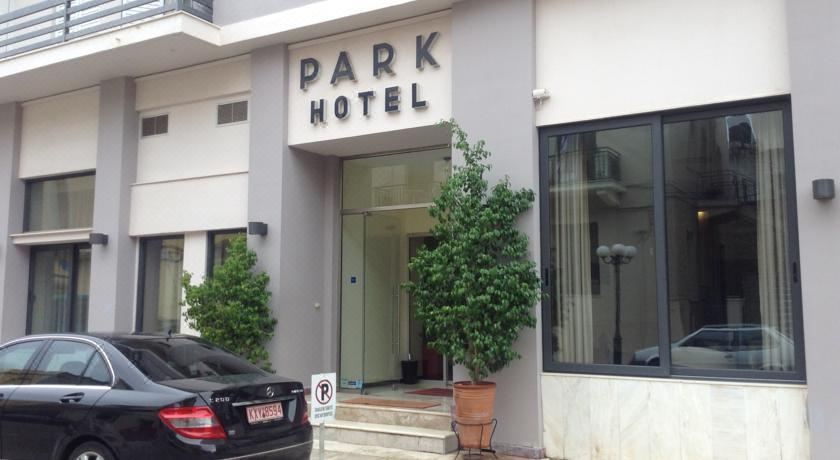 "a car parked in front of a hotel , with the words "" park hotel "" visible on the door" at Park Hotel