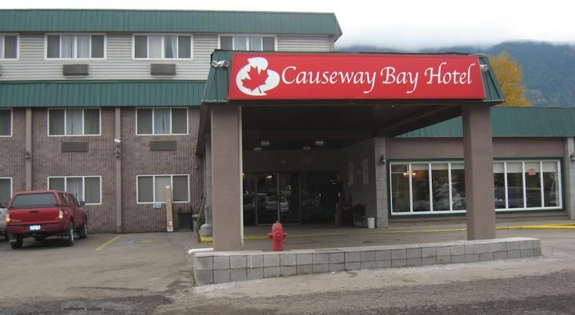 "a building with a sign that reads "" canada 's causeway bay hotel "" prominently displayed on the front" at Causeway Bay Hotel