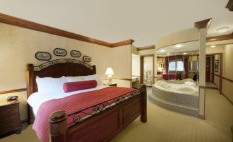 a luxurious hotel room with a king - sized bed and a jacuzzi in the corner , creating a relaxing atmosphere at Best Western Parkway Inn  Conference Centre