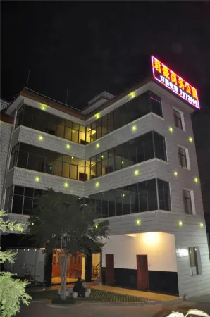 Tangchi Junhao Business Apartment Отели рядом с достопримечательностью «Dixiadao Stone Forest»